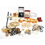 A collection of costume jewellery to include an amber coloured necklace and a ANCRE IS RUBIS