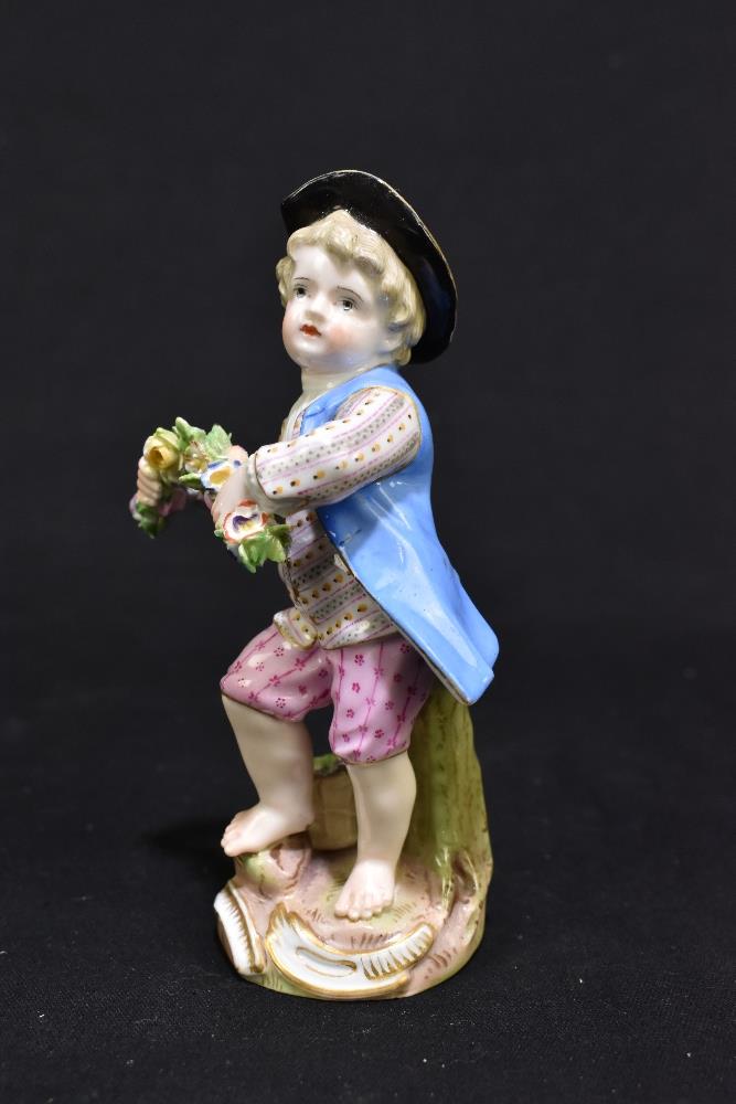 MEISSEN; a mid 19th century figure of a young child holding a garland of flowers, painted marks to - Image 5 of 9