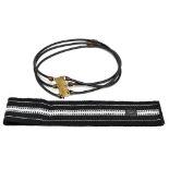 KENZO, PARIS; a black and white patterned woven fabric tie belt with black leather trim to ends