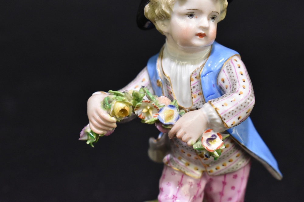 MEISSEN; a mid 19th century figure of a young child holding a garland of flowers, painted marks to - Image 6 of 9