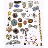 A small group of assorted costume jewellery, including dress ring, various brooches including an