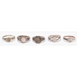 CHARLES HORNER; a group of five silver sterling silver and white metal rings, one with Chester