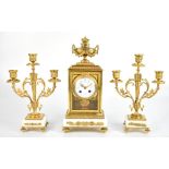 A late 19th century French gilt brass and alabaster clock garniture, the clock with urn surmount