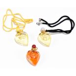 CHRISTIAN DIOR; a three heart shaped pendant glass bottle set containing three 4-5mls Christian Dior