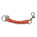 BOTTEGA VENETA; an Intrecciato red leather keyring/bag charm with silver tone hardware clasp at