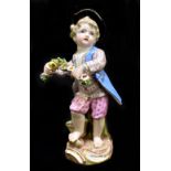MEISSEN; a mid 19th century figure of a young child holding a garland of flowers, painted marks to