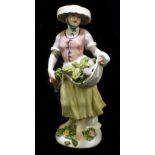 MEISSEN; a mid 18th century figure of a vegetable seller, circa 1750, modelled by Johann Frederick