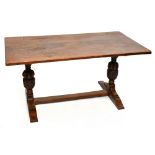 An 18th century style oak refectory type table, with rectangular top on turned and carved baluster