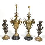 A pair of late Victorian style twin handled urn lamps with applied floral and mask head detail,