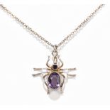 CHARLES HORNER; a George V hallmarked silver spider pendant suspended on fine link chain, Chester