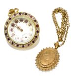 A yellow base metal oval locket on chain and a crown wind desk clock with Roman numerals with an