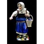 MEISSEN; an 18th century figure of a peasant woman selling fruit with basket over her left arm,