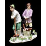 MEISSEN; an 18th century figure group of two gentlemen beside a basket, bearing two collection