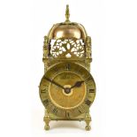 THOMAS MUDGE; an early 20th century brass lantern clock, the applied chapter ring with Roman