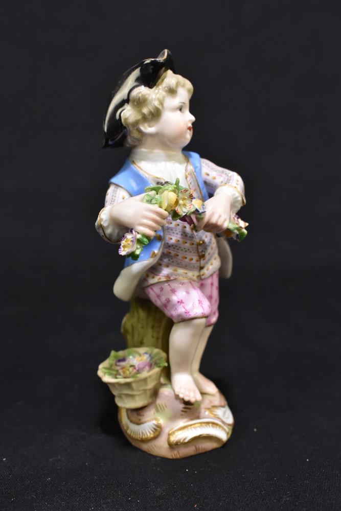 MEISSEN; a mid 19th century figure of a young child holding a garland of flowers, painted marks to - Image 2 of 9