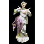 MEISSEN; an 18th century figure writing on a scroll, with pink gilt heightend robe, height 17cm,