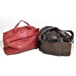 JACOB; a soft red grained leather holdall/weekend bag with two top handles, zips to front and