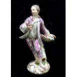 MEISSEN; an early 19th century figure of a gentleman in elaborate dress holding his hat in left hand