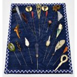 CHARLES HORNER; a collection of 1950s/60s hat pins, displayed on a velvet pad.