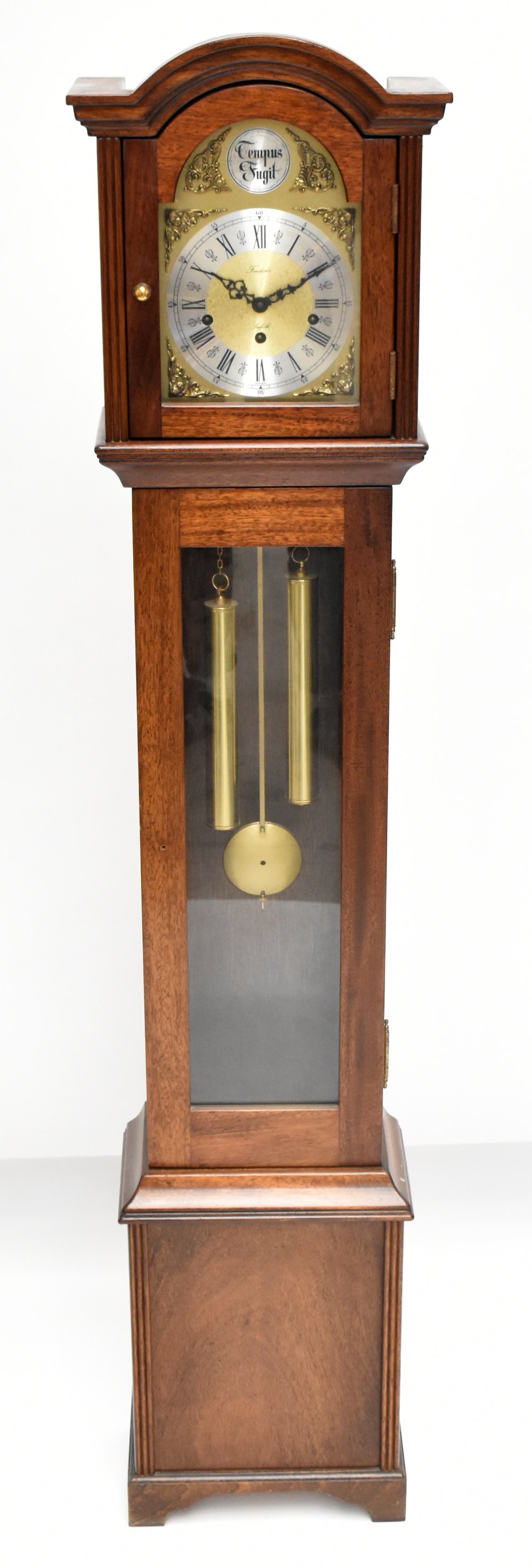A reproduction mahogany cased longcase clock of small proportions with brass face and silvered