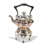 A silver plated spirit kettle on stand complete with burner and shaped handle, height 35cm.