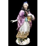 MEISSEN; an 18th century figure of a woman holding a fan in her left hand, painted marks to back