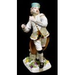 MEISSEN; an 18th century figure of a Saxon miner in ceremonial costume, modelled as a triangle