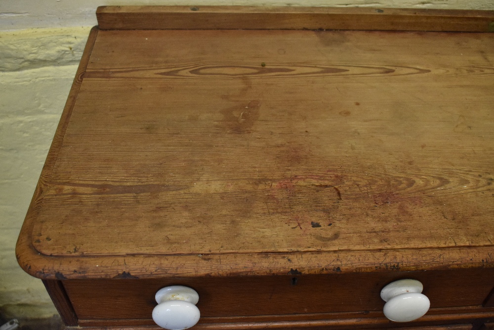 A Victorian pine chest of two rows of four graduated long drawers, with ceramic handles, on plinth - Image 4 of 7