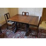 A 1930s oak draw-leaf dining table, with baluster legs on standard end supports, height 76cm,