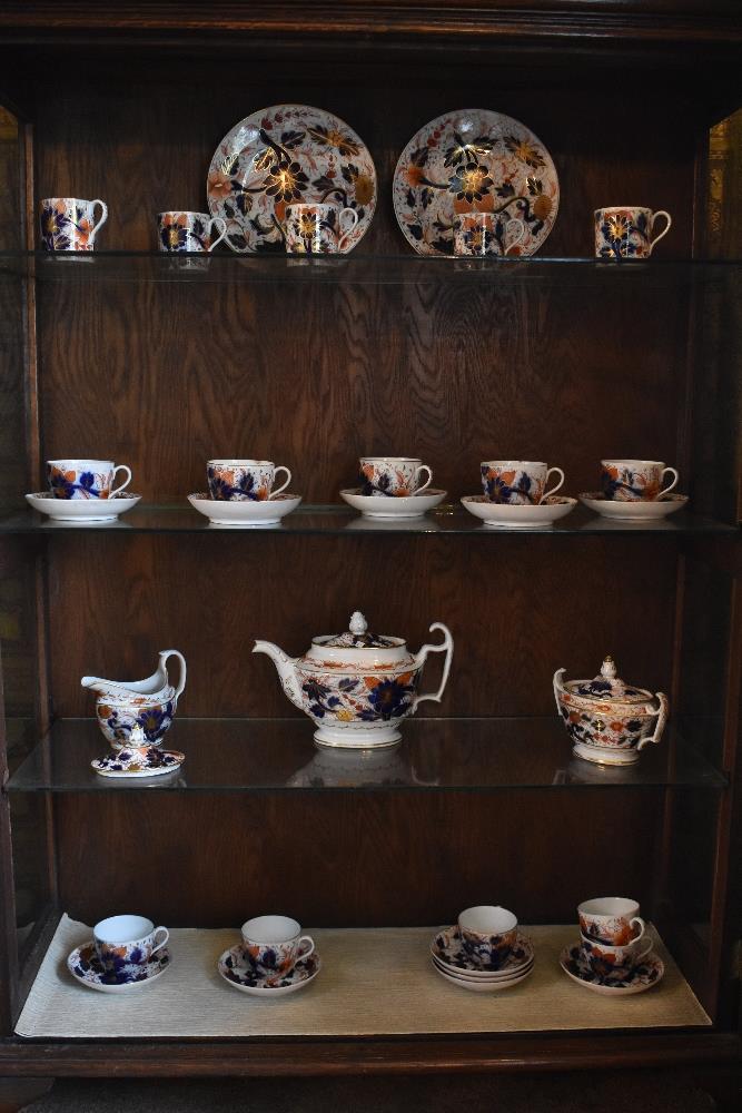 An early 19th century English china thirty-one piece Imari part tea and coffee service, comprising