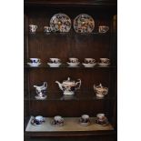 An early 19th century English china thirty-one piece Imari part tea and coffee service, comprising