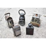 Five vintage lamps comprising a British Rail signalman's lamp, embossed B.R(M), height 30cm, a