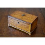 A Victorian amboyna box, with internal tray, on bracket feet, height 14cm, width 13cm, depth 18cm.