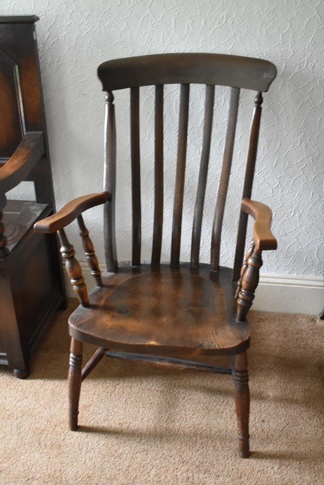 A 19th century beech and ash country kitchen chair with solid seat on turned legs, height 100cm.