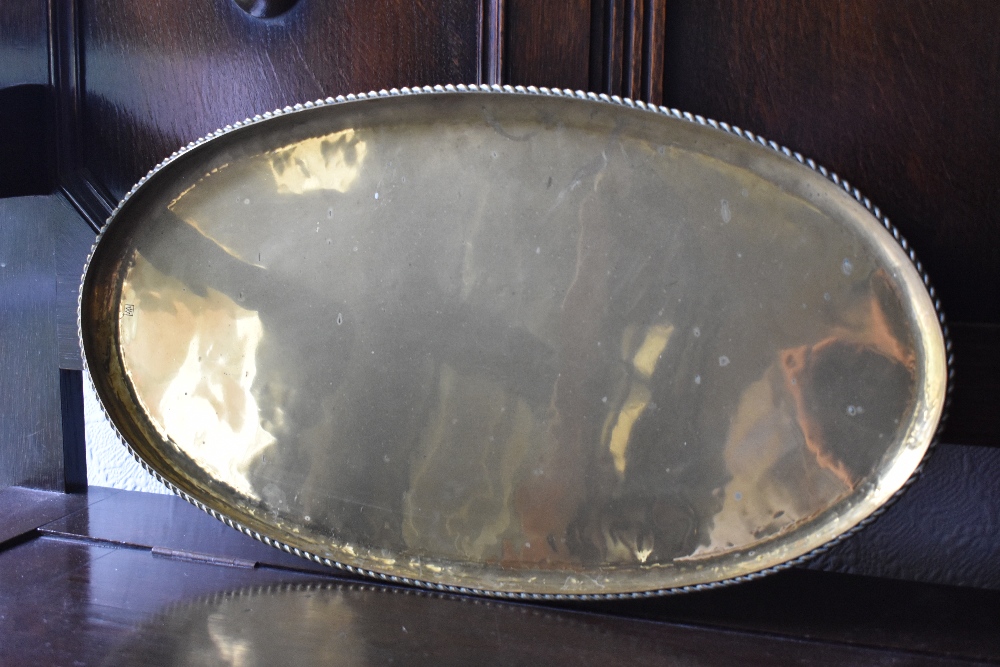 HUGH WALLACE; two brass dishes, one circular, diameter 28.5cm, and one oval, length 52cm, both - Image 2 of 4