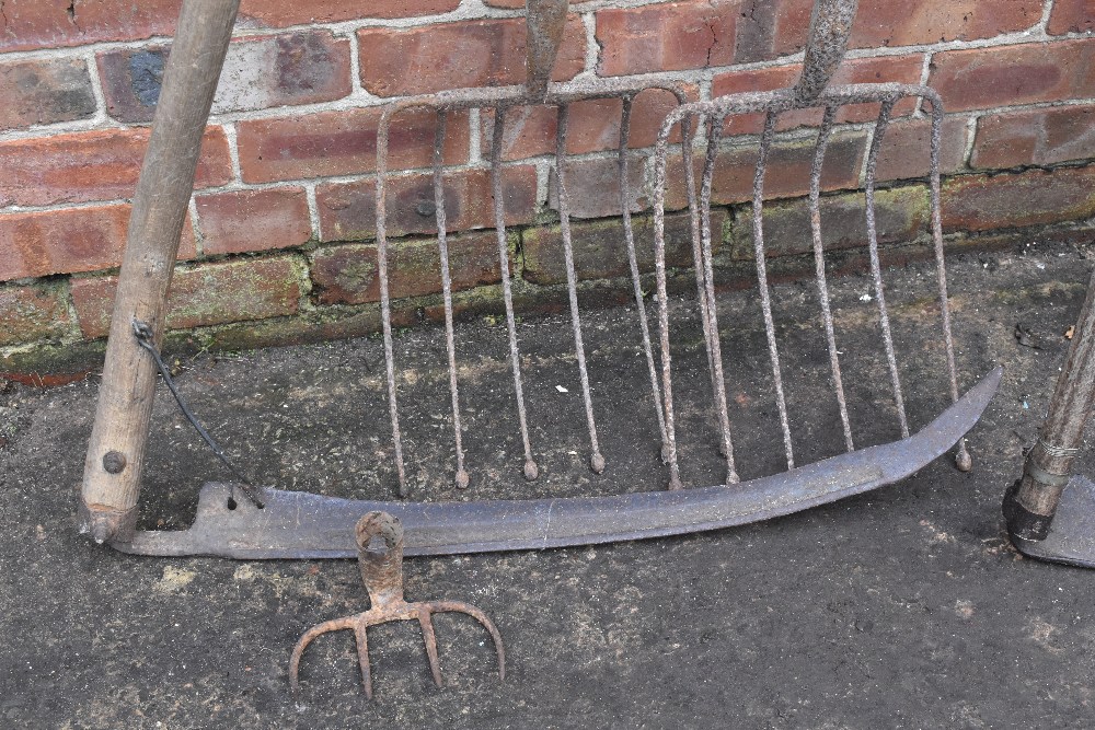 A vintage red painted wood and iron hay rake, two scythes, two potato forks, a fork and a fork head. - Image 2 of 8