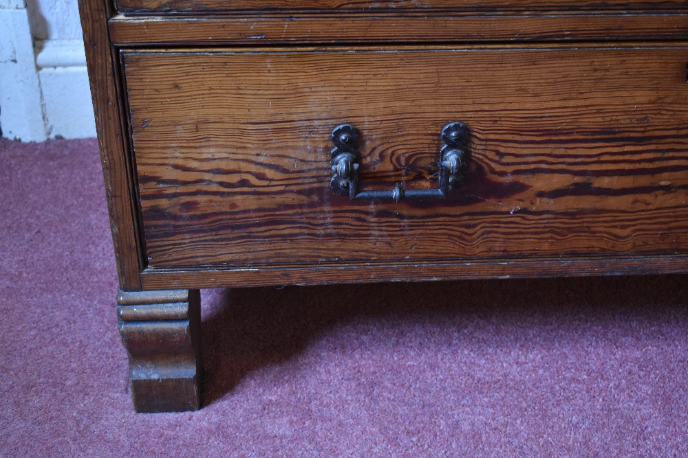 A late Victorian pitch pine chest of two short and three long drawers, on carved block feet, - Image 7 of 8