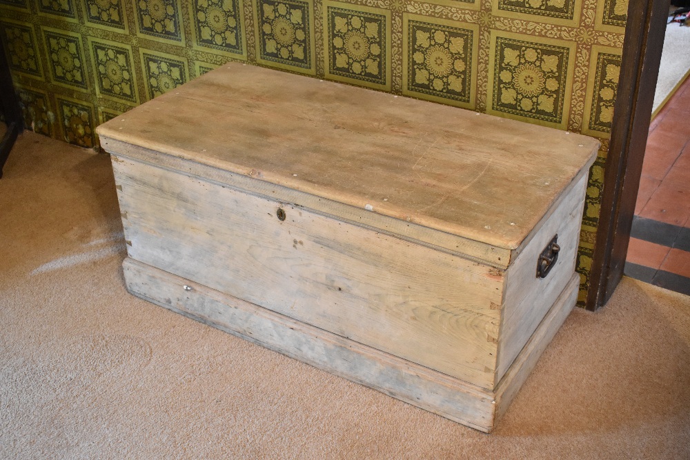 A 19th century large pine blanket box, height 52cm, width 116cm, depth 58cm. PROVENANCE: The Raymond