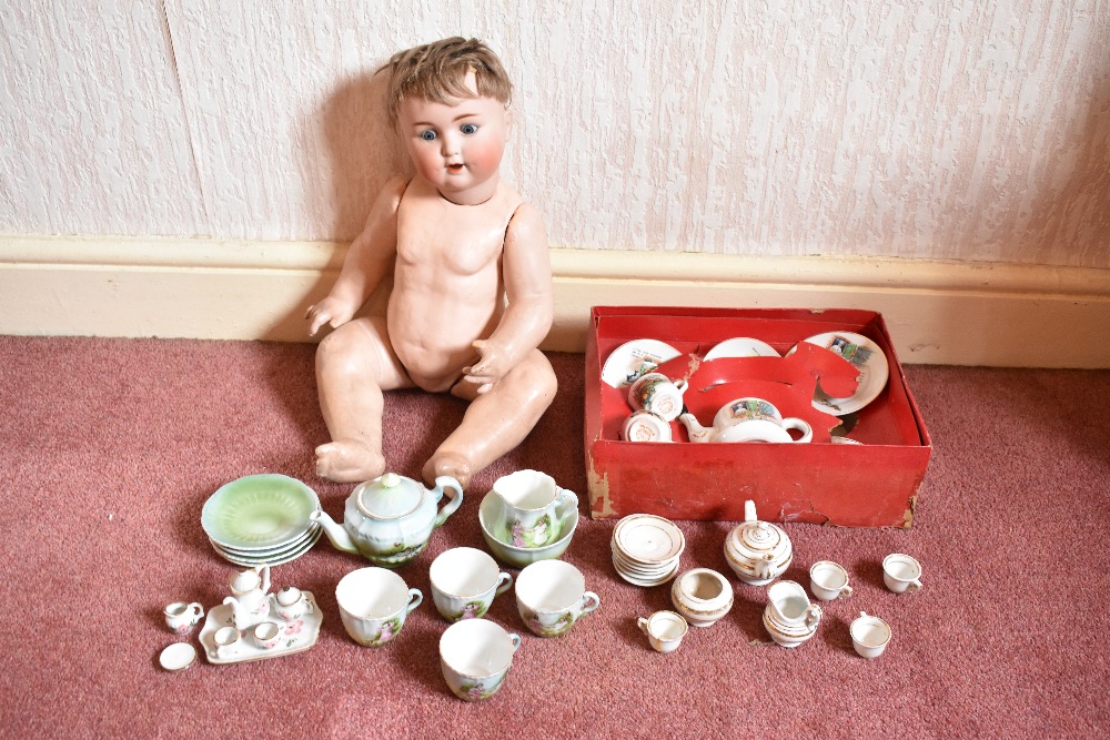 Four 19th century and later child's tea sets, comprising a thirteen piece part tea set with gilt