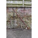 A collection of nine vintage agricultural and garden tools, including a long armed lopper, six