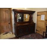 A Victorian carved walnut mirror back sideboard, with dentil cornice above two fluted and carved