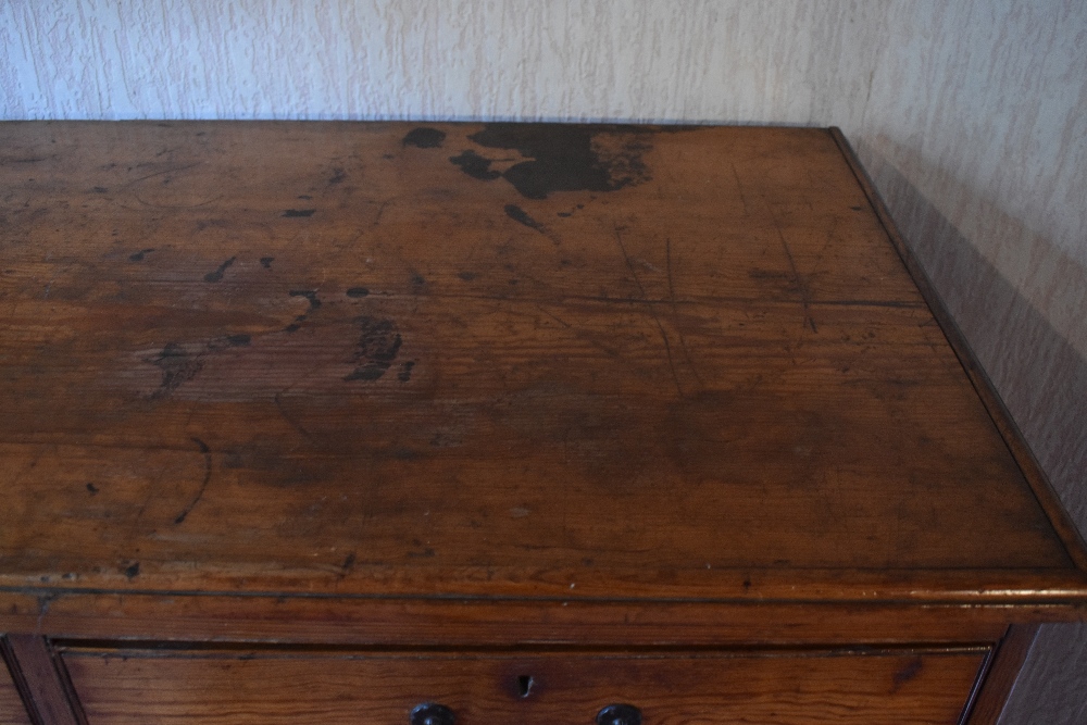 A late Victorian pitch pine chest of two short and three long drawers, on carved block feet, - Image 5 of 8