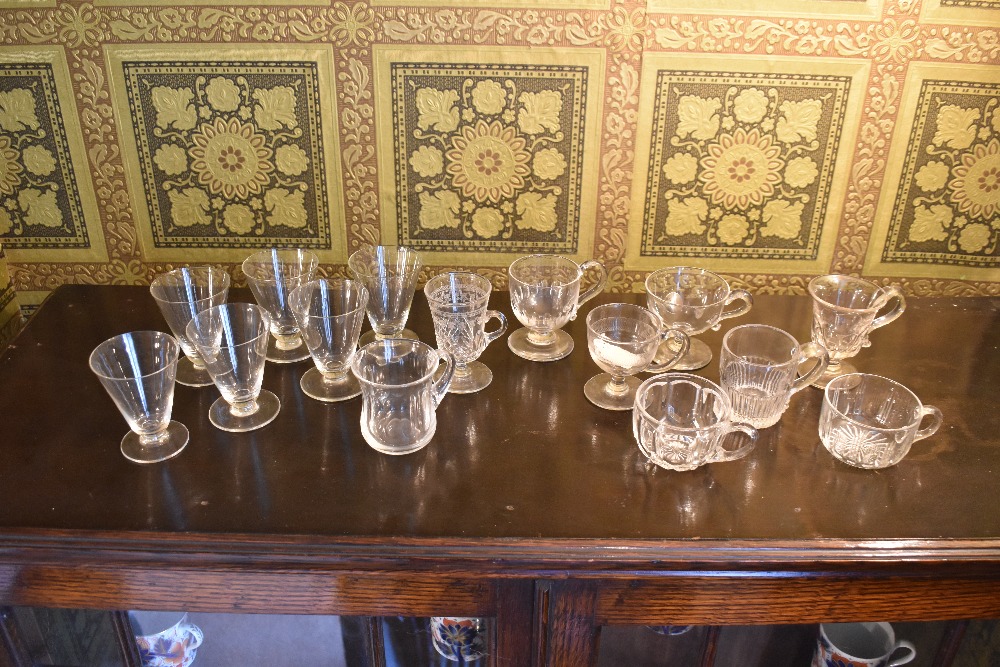 Eight 19th century and later glass custard cups/punch cups, and a set of six glass drinking glasses,