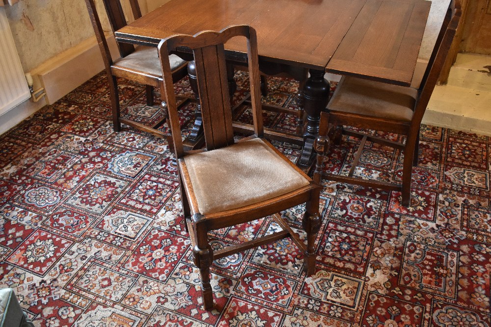 A 1930s oak draw-leaf dining table, with baluster legs on standard end supports, height 76cm, - Image 4 of 4