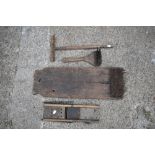 Two vintage treen and wrought iron carding tools, the smaller with carved detailing, the larger