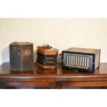 A 19th century walnut hexagonal concertina, with patterned black leather bellows, in fitted case,