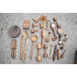 A collection of 19th century and later treen items including a shovel shaped scoop, wormed, a