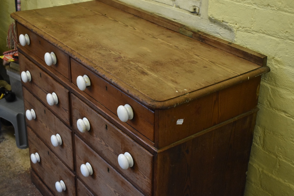 A Victorian pine chest of two rows of four graduated long drawers, with ceramic handles, on plinth - Image 2 of 7