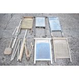 Five vintage treen and galvanised wash boards, height of tallest 70cm, also a wash paddle, six