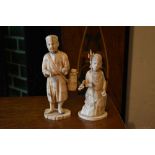 An early 20th century Japanese carved ivory figure of a gentleman pedlar, on oval base, and an early